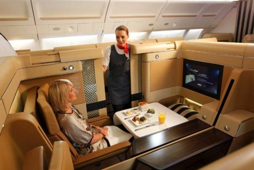 Premium airline suite with dining and lounge-style seating