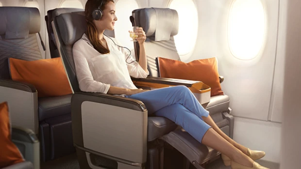 Premium economy seat with extended recline and footrest