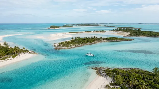 Bahamian sandbars and turquoise banks among low green cays
